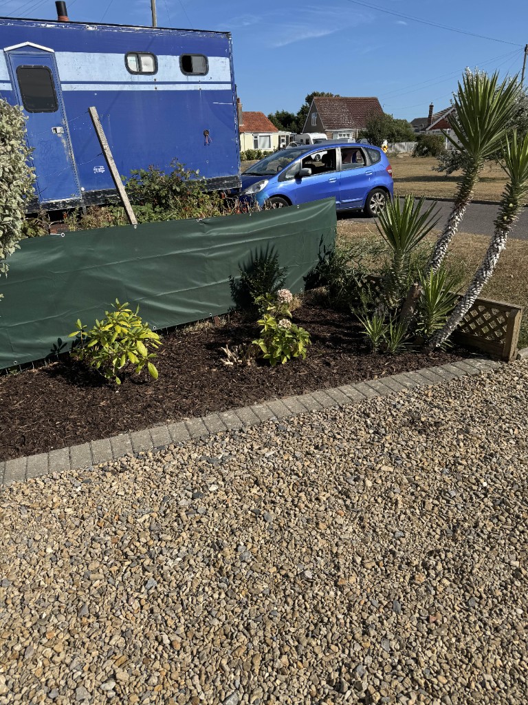 Weeded border finished with a deep bark mulch to lock in moisture and stop weeds, Hayling Island