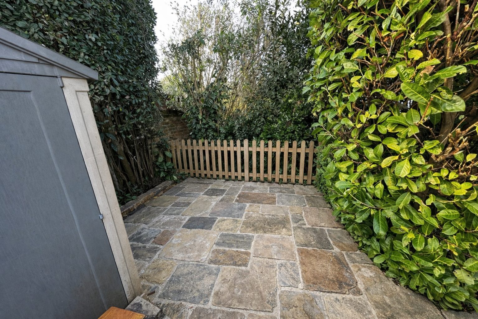 Courtyard after — clean stone paving